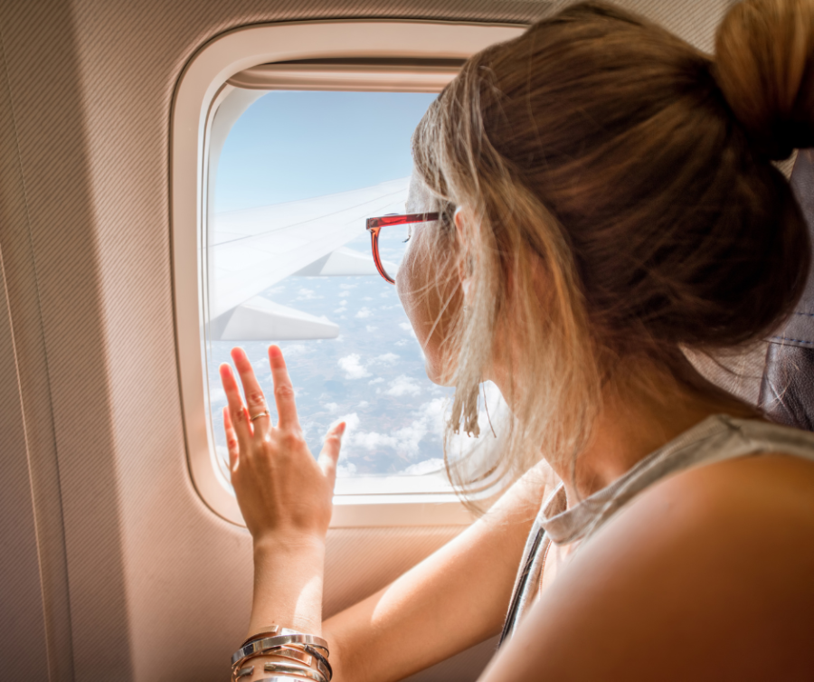 beauty jet lag woman looking outside the plain window